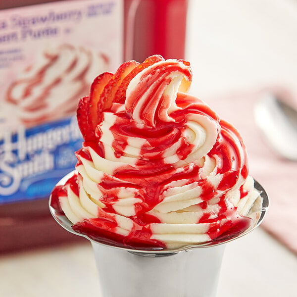 A bowl of frozen yogurt topped with J. Hungerford Smith Fiesta Strawberry Puree.