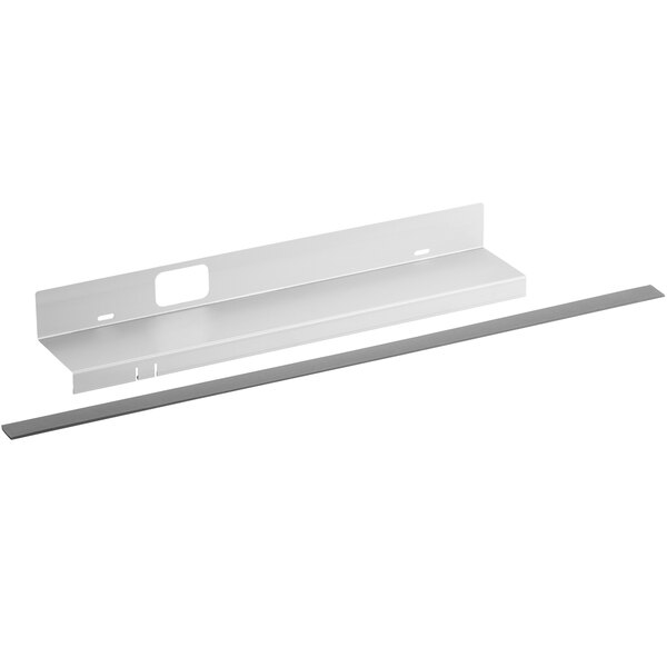 A white metal shelf with a metal strip on it.