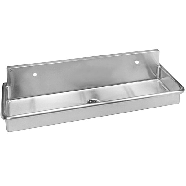 A Just Manufacturing stainless steel wall hung multi-station surgeon scrub sink with 2 faucet holes.