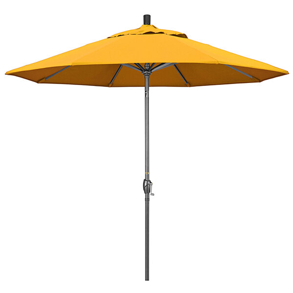 A close up of a yellow California Umbrella on a hammertone aluminum pole.