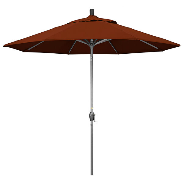 A brick red California Umbrella on a hammertone aluminum pole.