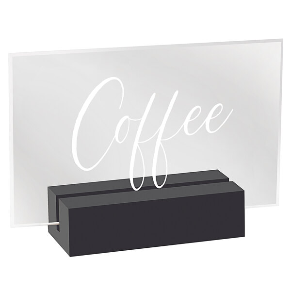 A black wood and clear acrylic sign with white lettering that says "Coffee" in a black box.