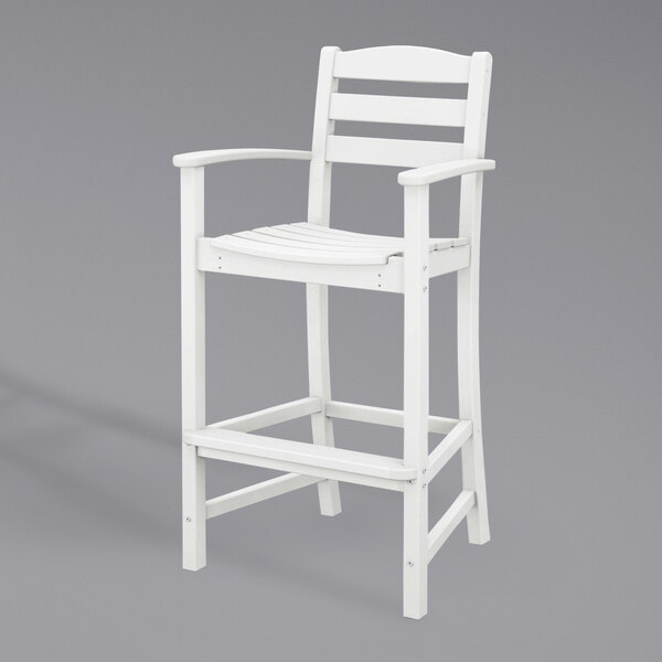 A white POLYWOOD La Casa Cafe bar height chair with armrests.