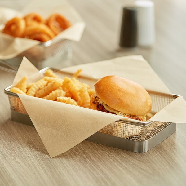 A burger and fries in a customizable EcoChoice kraft basket lined with a natural kraft liner.
