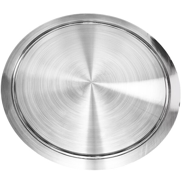 A silver circular metal plate with a circular pattern.