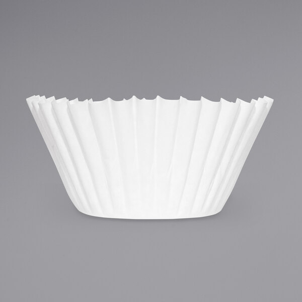 A white paper coffee filter with a gray background.