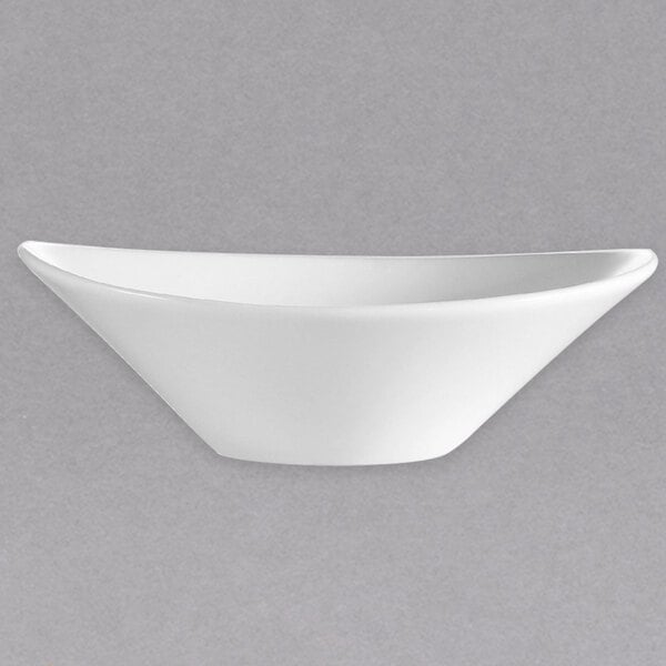 A CAC white porcelain oval salad bowl.