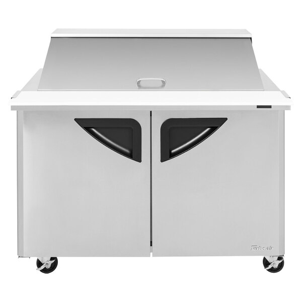 A stainless steel Turbo Air 2 door refrigerated sandwich prep table.