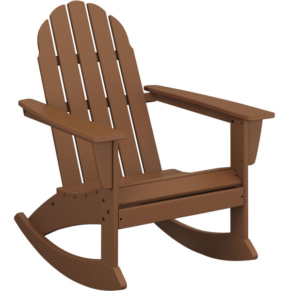A brown POLYWOOD Adirondack rocking chair with armrests and a wooden seat.