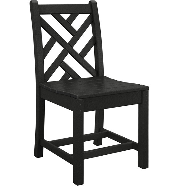 A black POLYWOOD Chippendale dining chair with a wooden seat and cross back.