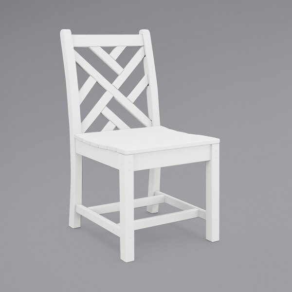 A white POLYWOOD Chippendale dining side chair with a wooden frame and a cross back.