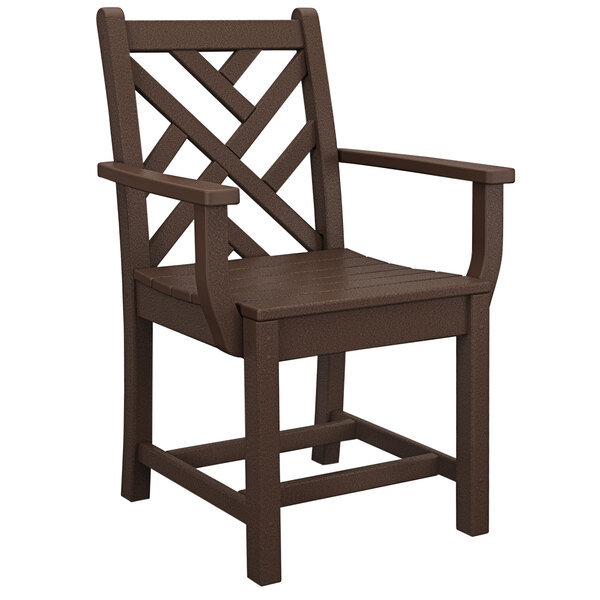 A brown POLYWOOD Chippendale outdoor dining arm chair with a cross back and arms.