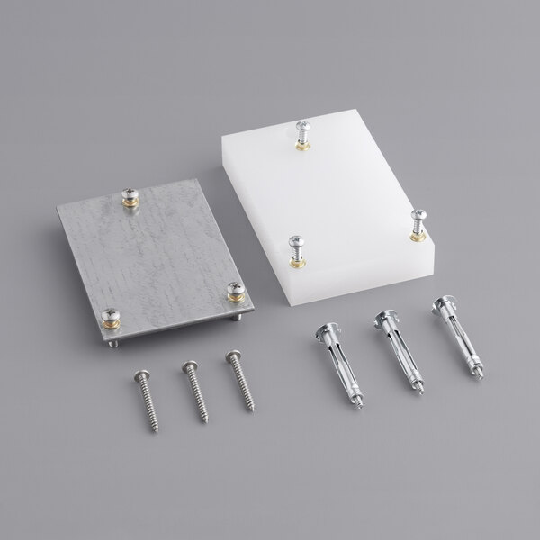 A white rectangular metal plate with screws.