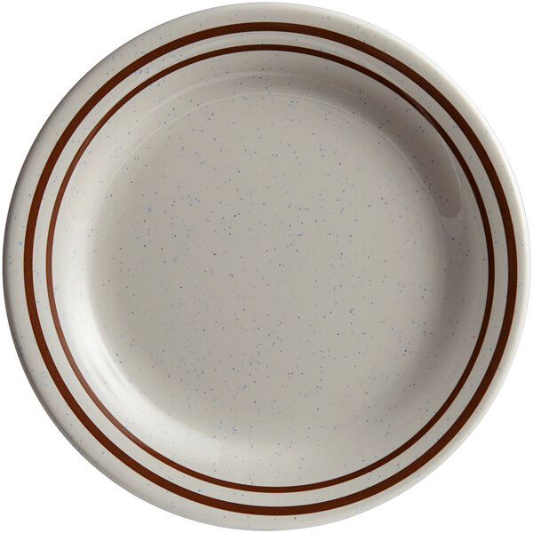 A beige melamine plate with brown speckled lines.
