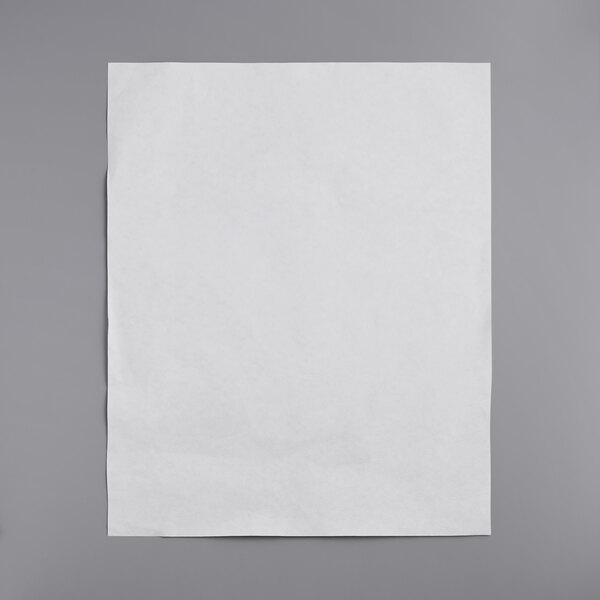 A white paper filter on a gray surface.