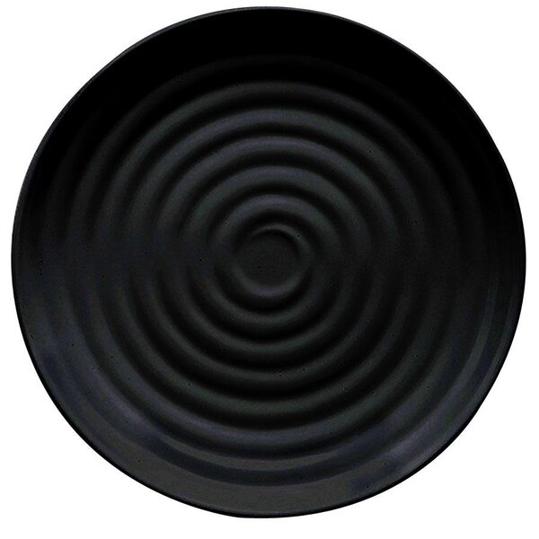 A black plate with a spiral pattern on it.