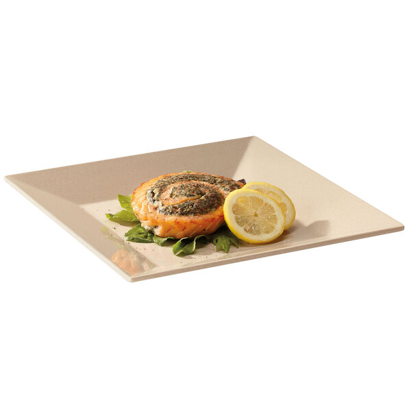 A GET BamboMel square plate with a piece of salmon and a lemon slice on it.