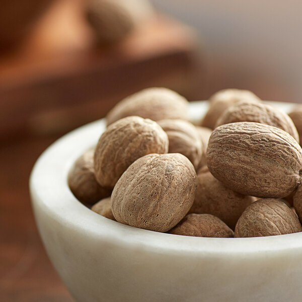 A bowl of Regal Whole Nutmeg.