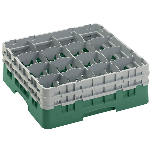 A green plastic Cambro glass rack with 16 compartments.