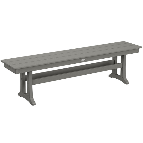 A POLYWOOD slate grey bench with trestle legs.