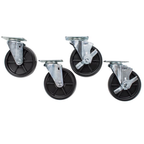 A set of four casters with black metal wheels and black rubber tires.