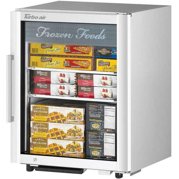 A white Turbo Air countertop freezer with frozen foods on shelves.