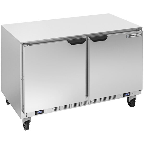 A silver Beverage-Air undercounter refrigerator/freezer with wheels.