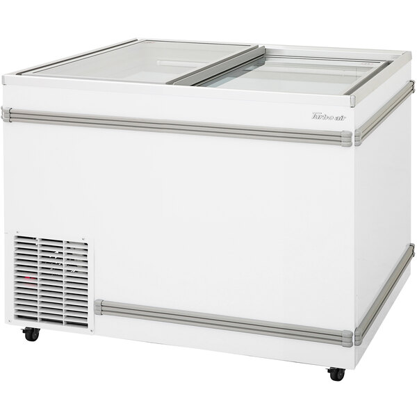 A white Turbo Air display freezer with a flat glass lid.