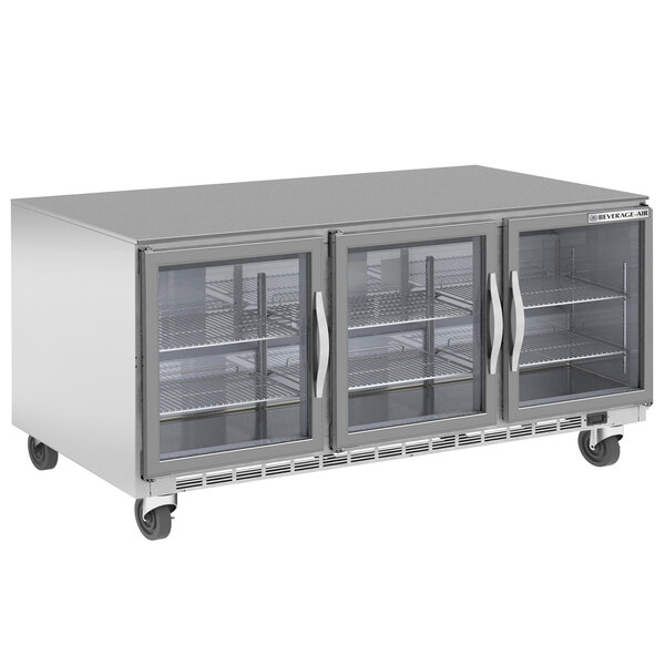 A Beverage-Air stainless steel undercounter refrigerator with three glass doors.