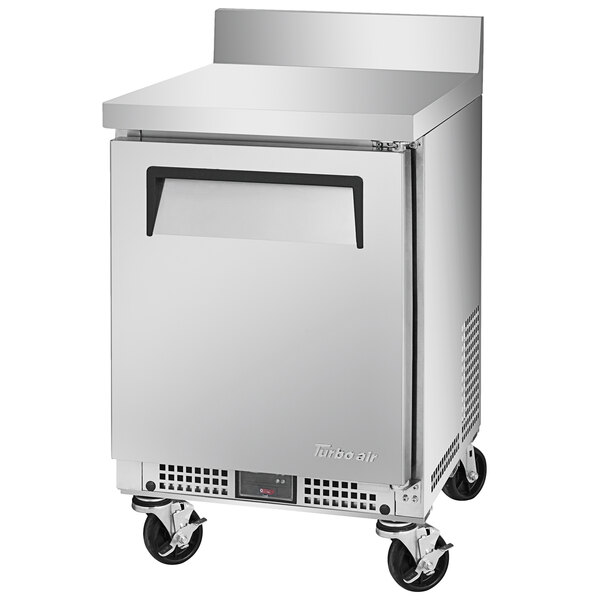 A silver Turbo Air undercounter refrigerator with a black handle and wheels.