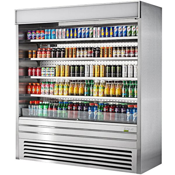 A Turbo Air stainless steel vertical air curtain display case with drinks on shelves.