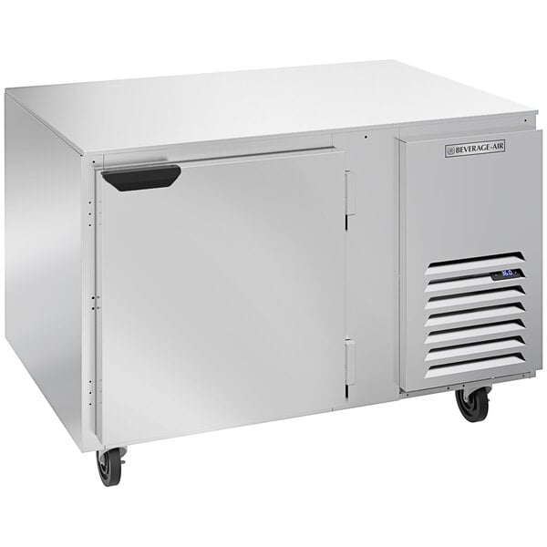 A silver stainless steel Beverage-Air undercounter refrigerator with a left-hinged door on wheels.