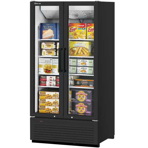 A Turbo Air Super Deluxe black glass door freezer filled with food on display in a deli.