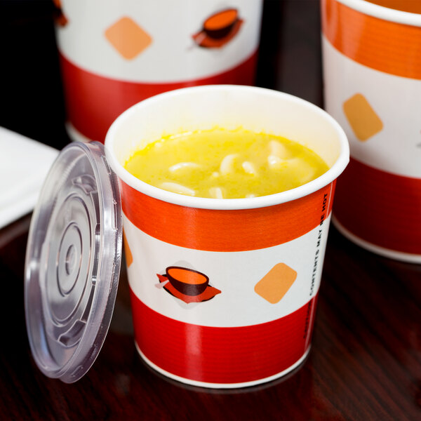 A close up of a Choice paper soup cup filled with soup and noodles.