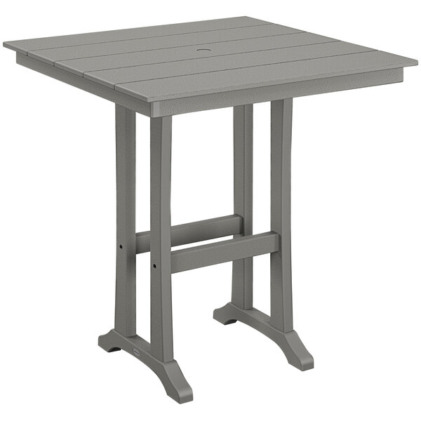 A POLYWOOD gray bar height table with a wooden top and legs.