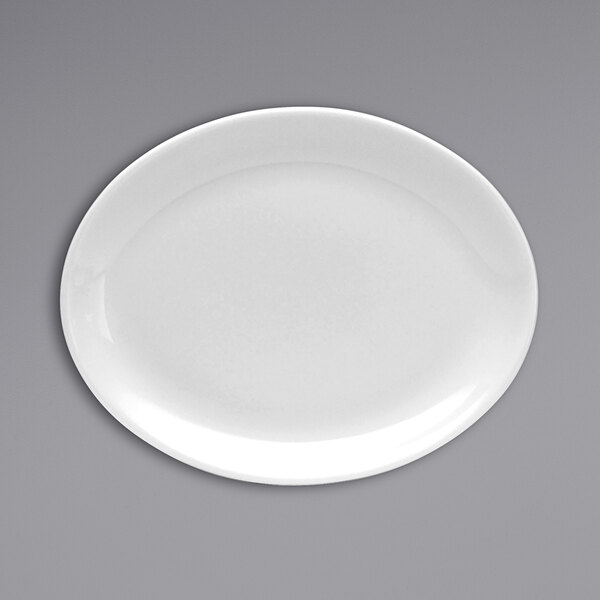 An oval warm white china platter with a wide white rim.