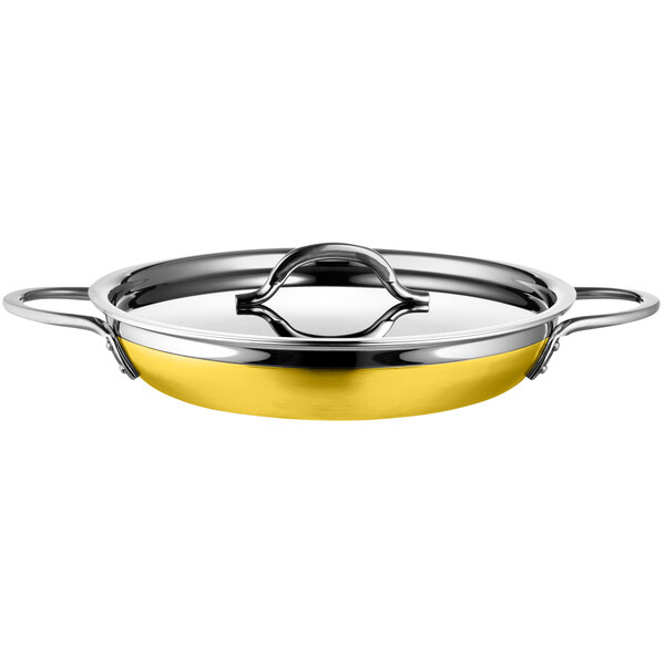 A yellow stainless steel Bon Chef double handle saute pan.