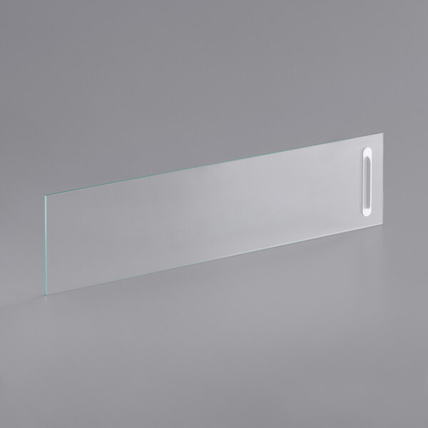 A clear glass door with a white handle.