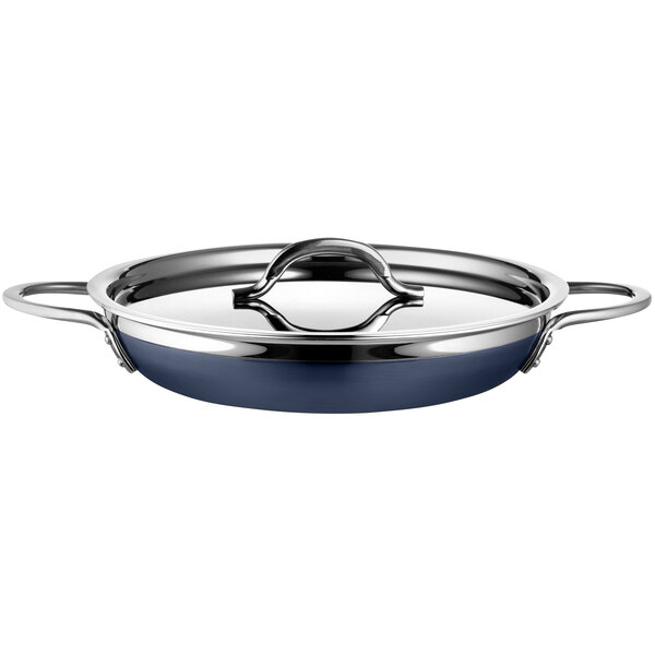 A Bon Chef stainless steel double handle saute pan in cobalt blue.