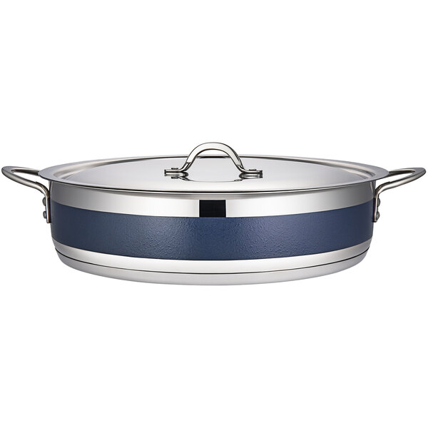 A Bon Chef stainless steel brazier pot with cobalt blue handles.