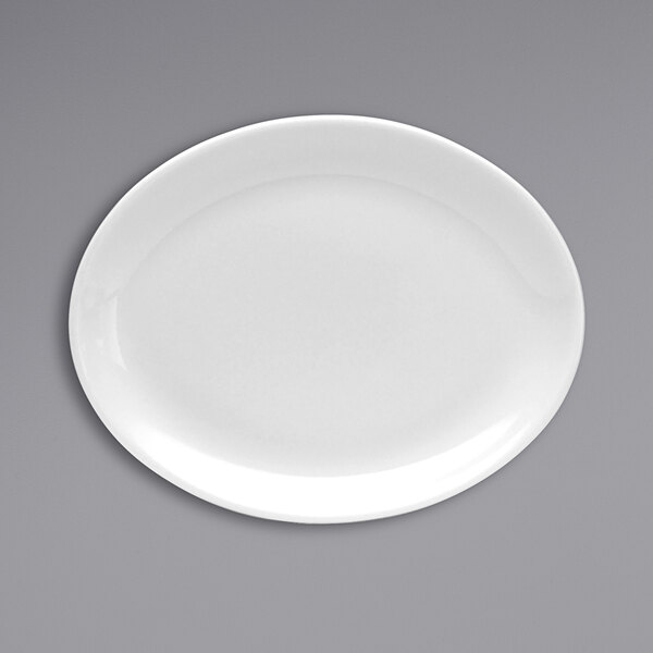 An Oneida Tundra white china platter with a white rim on a gray surface.