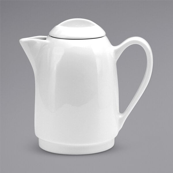 A Oneida Tundra warm white china teapot with a lid and handle.
