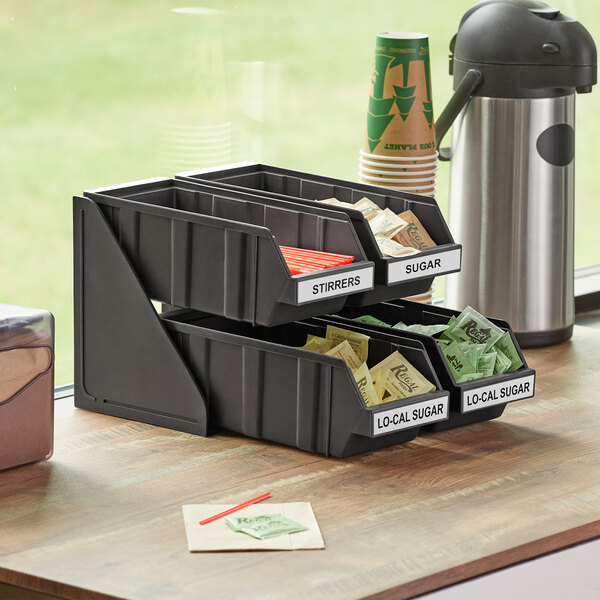 A black 2-tier self-serve organizer set with bins and label sheets.