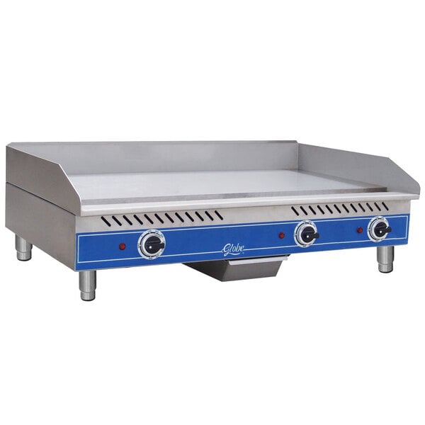 A Globe stainless steel countertop grill with blue handles.