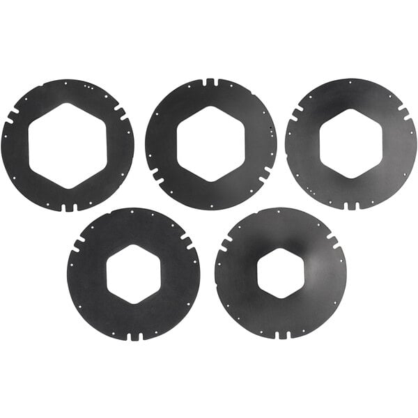 A group of four black circular metal gaskets with holes in them.