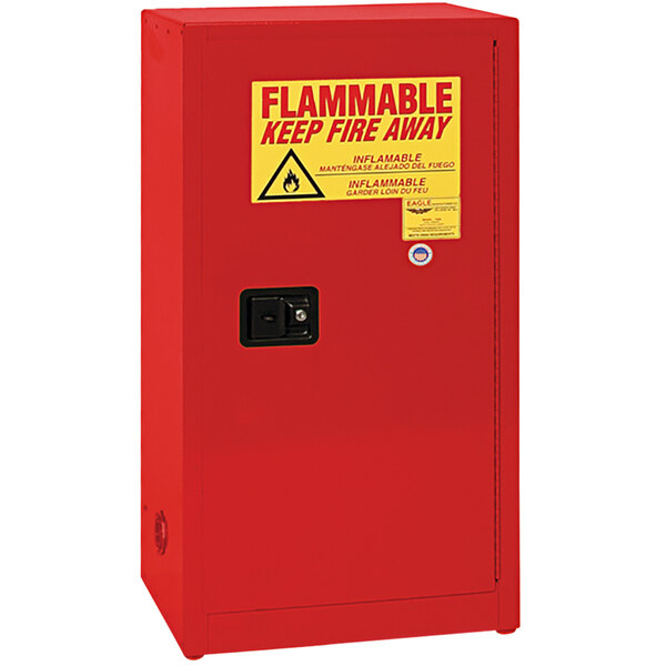 A red Eagle Manufacturing safety cabinet with a yellow and red warning sign.