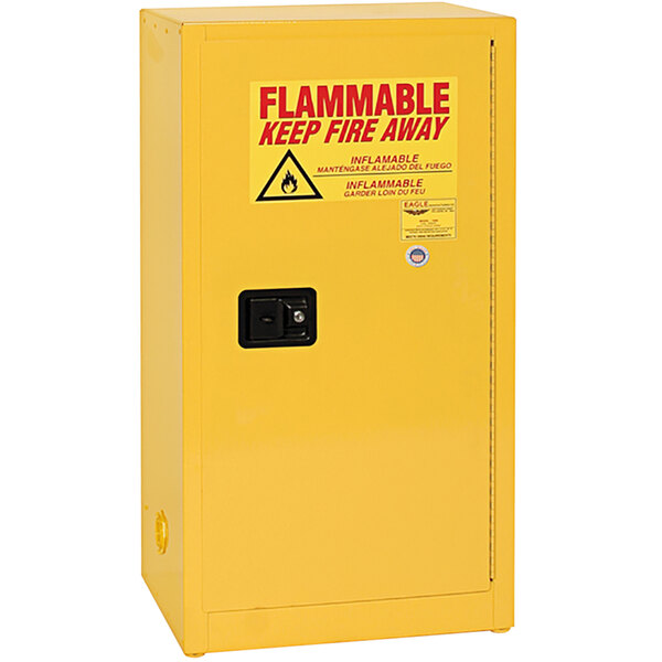 A yellow Eagle Manufacturing safety cabinet for flammable liquids with a self-closing door.