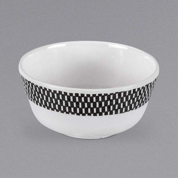 A white bowl with a black and white checkered rim.