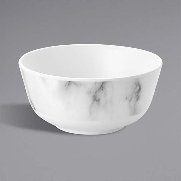A white bowl with a marble pattern in grey and black.