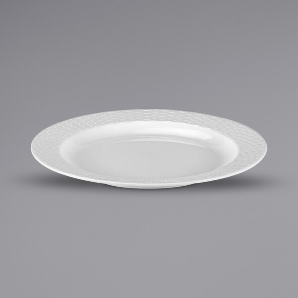A white oval Bon Chef melamine plate with a pattern.